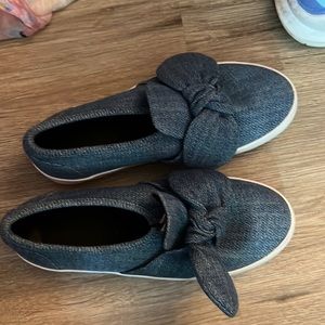 Denim sneakers worn